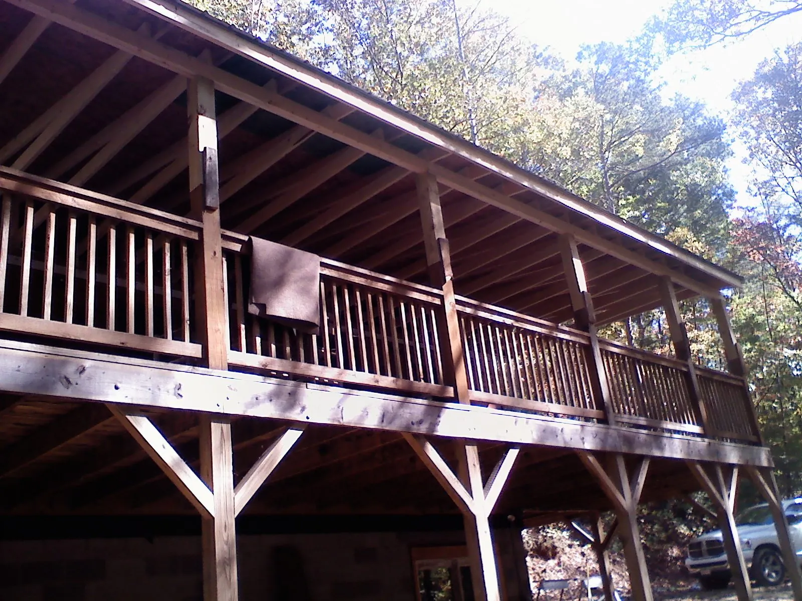 Timber framing under a new elevated porch and deck — Roof Leak Repair in Lamoure by Roofing Brothers